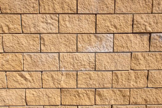 Textured brick wall on a sunny summer day. Preparation for the designer.