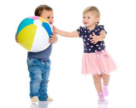 Toddler boy and girl playing with ball. The concept of a harmonious development of a child in the family, a happy childhood. Isolated on white background.