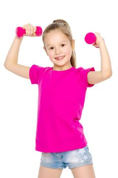 A cute little girl doing exercises with dumbbells. The concept of strength, health and sport. Isolated on white background.