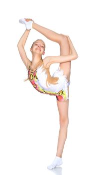 A girl gymnast balances on one leg.The concept of childhood, sport, a healthy lifestyle. Isolated on white background.