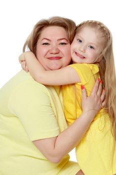 Mom and little daughter plus the size of the model, gently embrace. A woman and her daughter are smiling in a happy manner. Good for the concept of health, happiness, diet, obesity, weight loss.