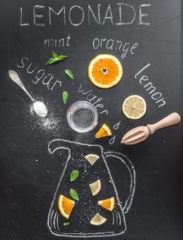 Orange lemonade and ingredients for its preparation on a black background