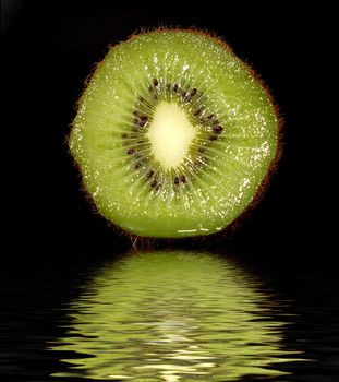 tropical fruit sweet ripe kiwi. black background