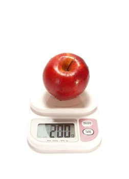 Red apple and scale isolared on white background