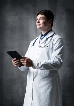 The doctor with the computer tablet. Digital technology in healthcare