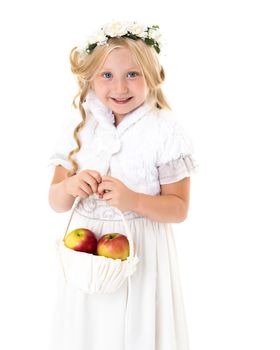 Little girl with a basket of apples. The concept of healthy eating, happy childhood. Isolated on white background.