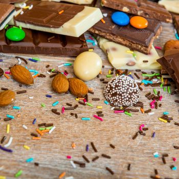 chocolate and candies on a wooden background