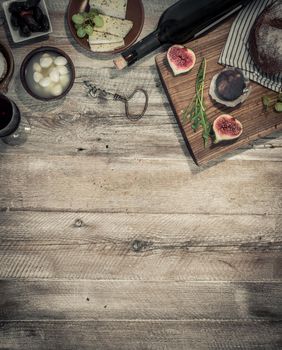 cheeses and brown bread on wooden table with text space