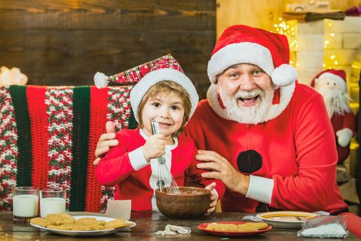 Happy grandfather and child grandson cooking Christmas cookie. Christmas kitchen