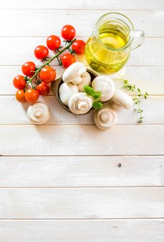 food ingredients for cooking vegetarian food on a wooden background