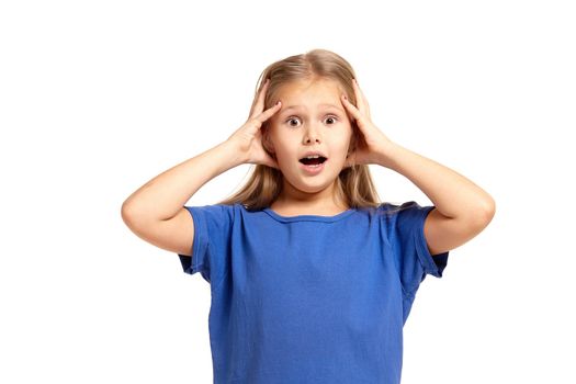 Portrait of adorable little girl isolated on a white background. in blue t-short with long white hair, worried, holding her head