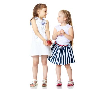 Two cute little girls in full growth, in the studio on a white background. The concept of a happy childhood, Beauty and fashion. Isolated.