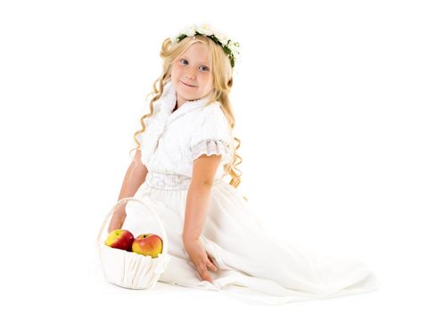 Little girl with a basket of apples. The concept of healthy eating, happy childhood. Isolated on white background.