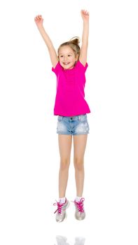 A little girl gymnast joyfully jumps and wags her hands. The concept of sport and fitness. Isolated over white background