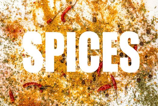 spice word on the background of spilled spices