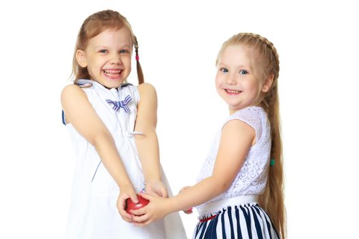 Two cute little girls close-up, in the studio on a white background. The concept of a happy childhood, Beauty and fashion. Isolated.