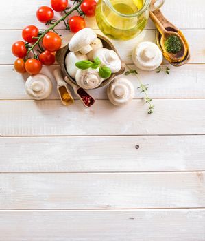 food ingredients for cooking vegetarian food on a wooden background