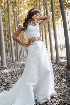 Portrait of beautiful bride outdoors in a forest