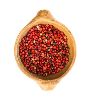 Pink peppercorn isolated on white