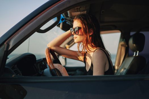 woman driving in car trip posing fashion travel. High quality photo