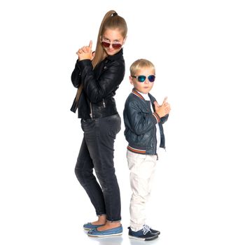 A teenage girl with her younger brother. studio photo session. The concept of family happiness.Isolated on white background.