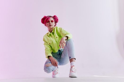 pretty woman with pink hair creative neon background. High quality photo