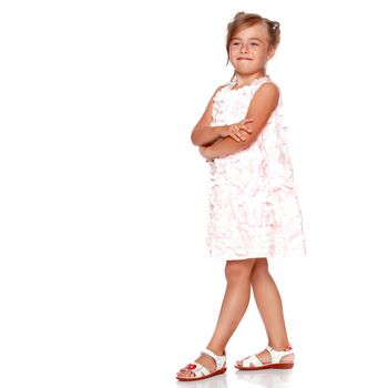 Studio portrait of a beautiful little girl. The concept of fashion, family happiness, harmonious development of the child. Isolated on white background.