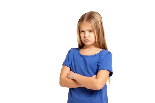 Portrait of adorable little girl isolated on a white background. in blue t-short with long white hair, upset