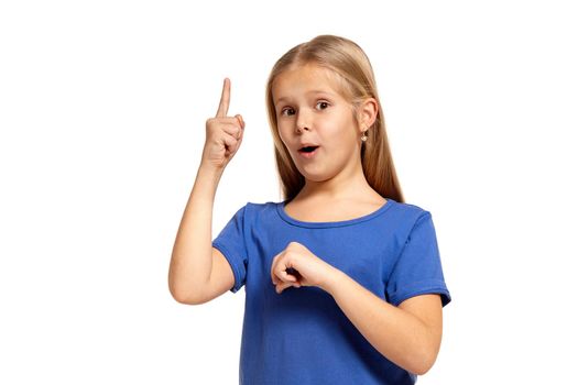 Portrait of adorable little girl isolated on a white background. in blue t-short with long white hair, pointing with finger, found solution