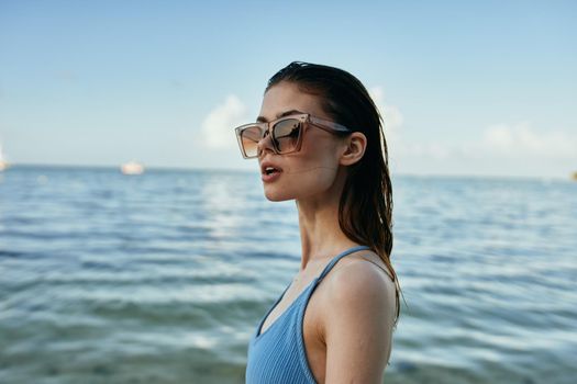 woman in swimsuit jungle exotic tropical green leaves. High quality photo