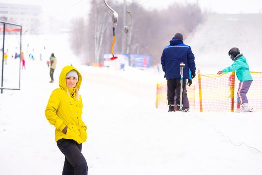 Tourists enjoy to play ski and snowboard at ski resort on holiday.