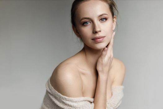 Portrait of a young pretty woman indoor in studio, skin wellness. High quality photo