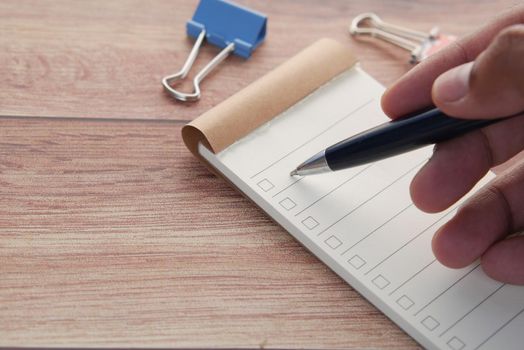 check mark on a check box on a paper .