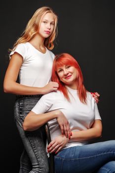 Young mother and little daughter gently embrace. The concept of Happy Childhood, Family Happiness, Raising a Child.