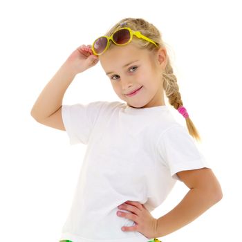 Fashionable little girl in sunglasses. The concept of outdoor recreation, tourism. Isolated on white background.