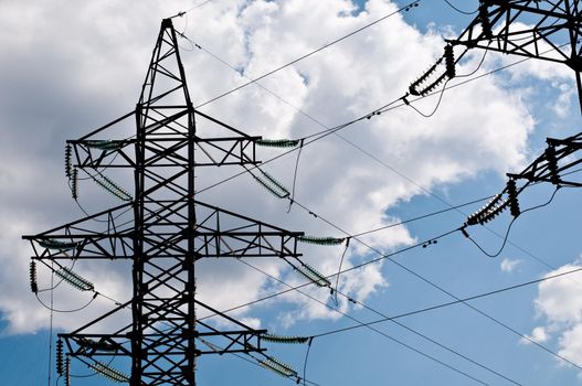 electric line with cloudy blue sky at background