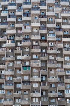 ugly hive like resident block building with lots of windows and balconies