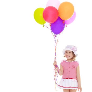 Little girl is playing with a balloon. The concept of the holiday, birthday. Isolated over white background