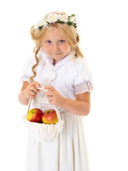 Little girl with a basket of apples. The concept of healthy eating, happy childhood. Isolated on white background.