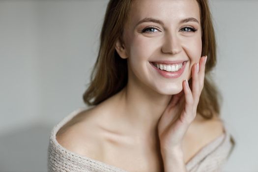 Young happy woman with cream . High quality photo