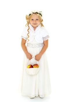 Little girl with a basket of apples. The concept of healthy eating, happy childhood. Isolated on white background.