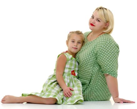 Happy family mom and little daughter, studio portrait on white background.Isolated.