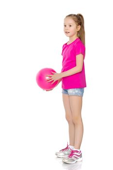 A charming little girl is engaged in fitness with a ball. The concept of gymnastics, health and sports. Isolated on white background.