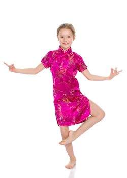 Little girl in Chinese national dress. The concept of style and fashion, the costumes of the peoples of the world. Isolated on white background.