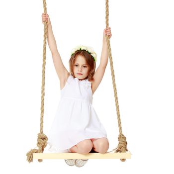 Studio portrait of a beautiful little girl. The concept of fashion, family happiness, harmonious development of the child. Isolated on white background.