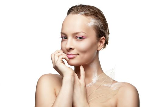 Beautyful smiling woman with creative make-up and white paint on body isolated