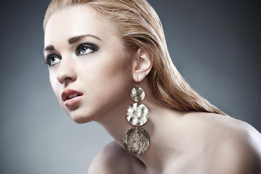 Beautiful woman with evening make-up. Jewelry and Beauty. Fashion photo