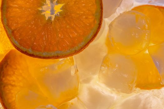 Orange fruit with ice macro detail inside. Background