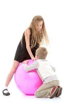 Toddler boy and girl playing with ball. The concept of a harmonious development of a child in the family, a happy childhood. Isolated on white background.