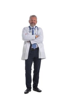 Mature happy confident male doctor with folded arms full length isolated on white background